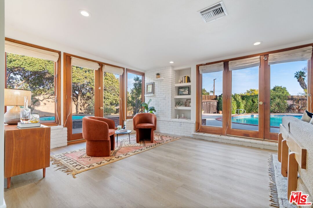 20650 Stagg Street Winnetka, CA 91306 - Photo 14 of 42 a living room with furniture cabinets and wooden floor