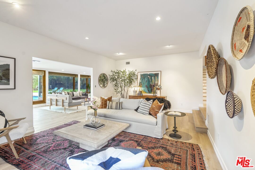 20650 Stagg Street Winnetka, CA 91306 - Photo 15 of 42 a living room with furniture and a large window