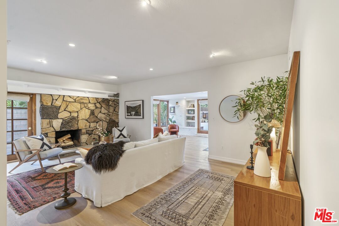 20650 Stagg Street Winnetka, CA 91306 - Photo 16 of 42 a living room with furniture a window and a flat screen tv