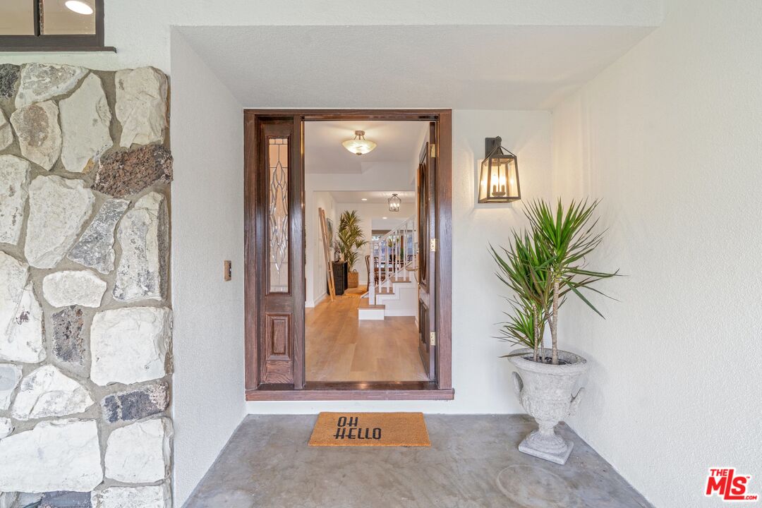 20650 Stagg Street Winnetka, CA 91306 - Photo 3 of 42 a view of an entryway with wooden floor