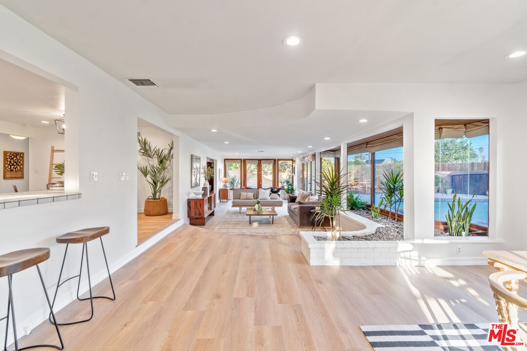 20650 Stagg Street Winnetka, CA 91306 - Photo 21 of 42 a living room with furniture and large windows
