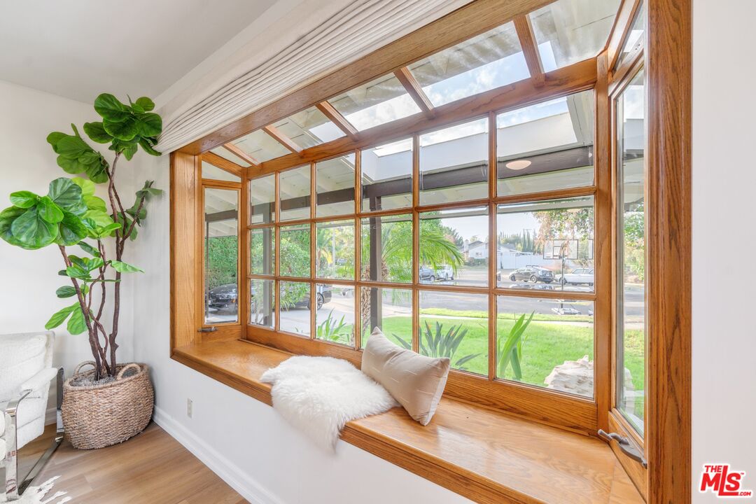 20650 Stagg Street Winnetka, CA 91306 - Photo 25 of 42 a living room with furniture and a potted plant