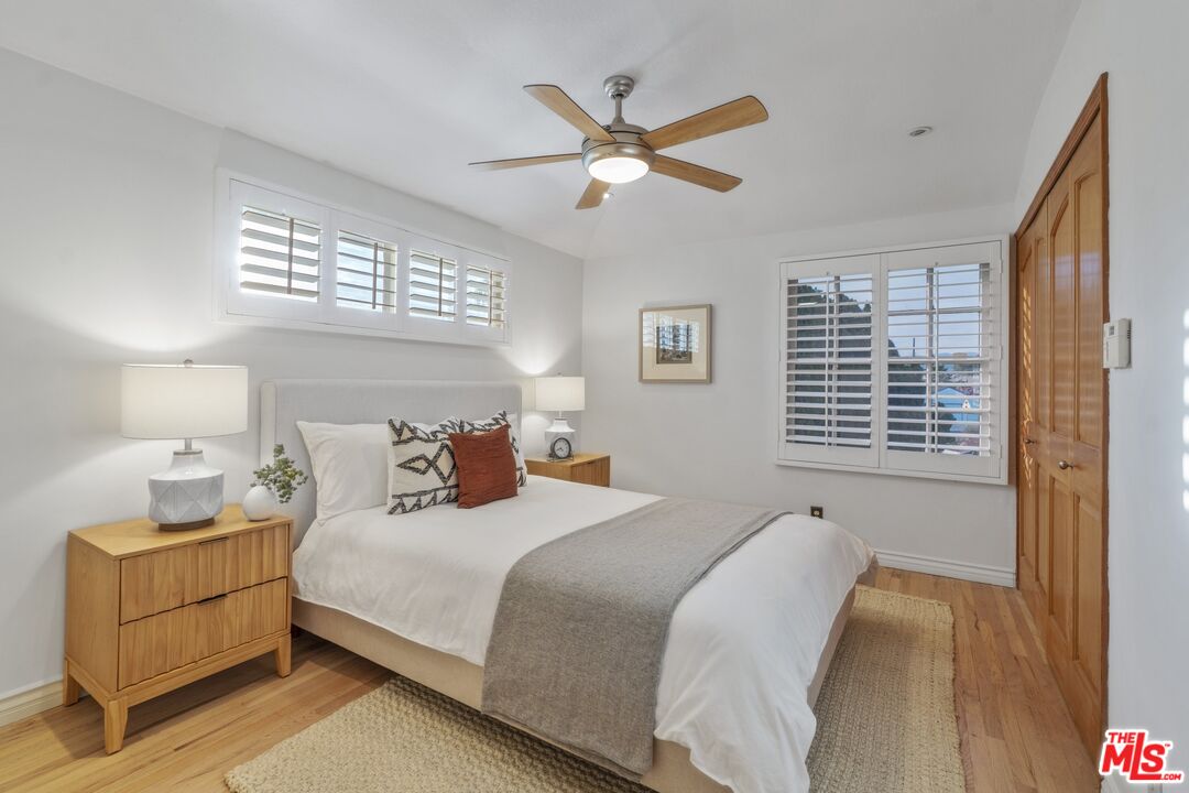 20650 Stagg Street Winnetka, CA 91306 - Photo 29 of 42 a bedroom with a bed and window