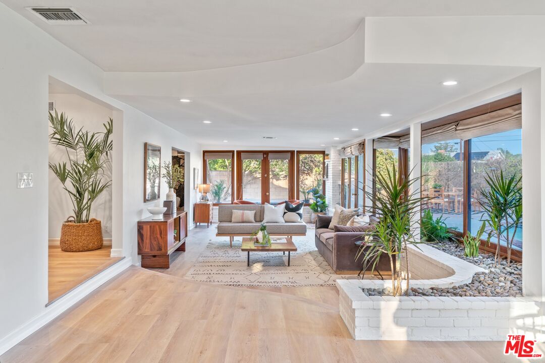 20650 Stagg Street Winnetka, CA 91306 - Photo 4 of 42 a living room with furniture and a large window