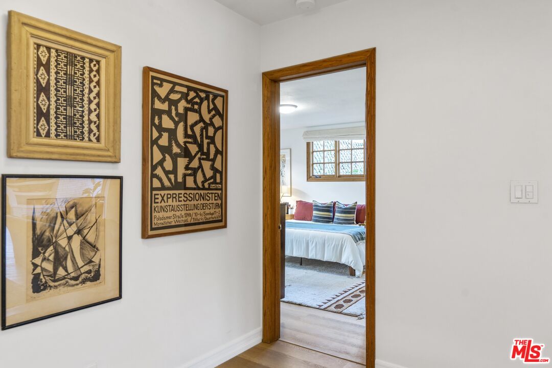 20650 Stagg Street Winnetka, CA 91306 - Photo 31 of 42 a view of a hallway and a painting on the wall