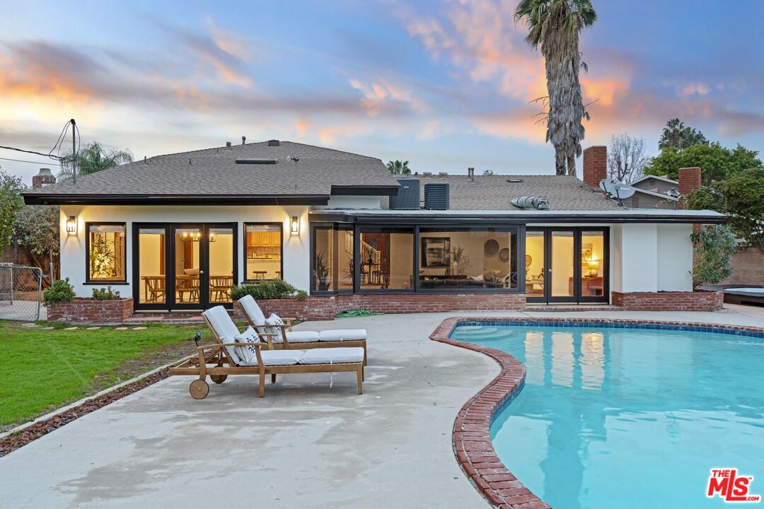 20650 Stagg Street Winnetka, CA 91306 - Photo 35 of 42 a view of a house with swimming pool and sitting area