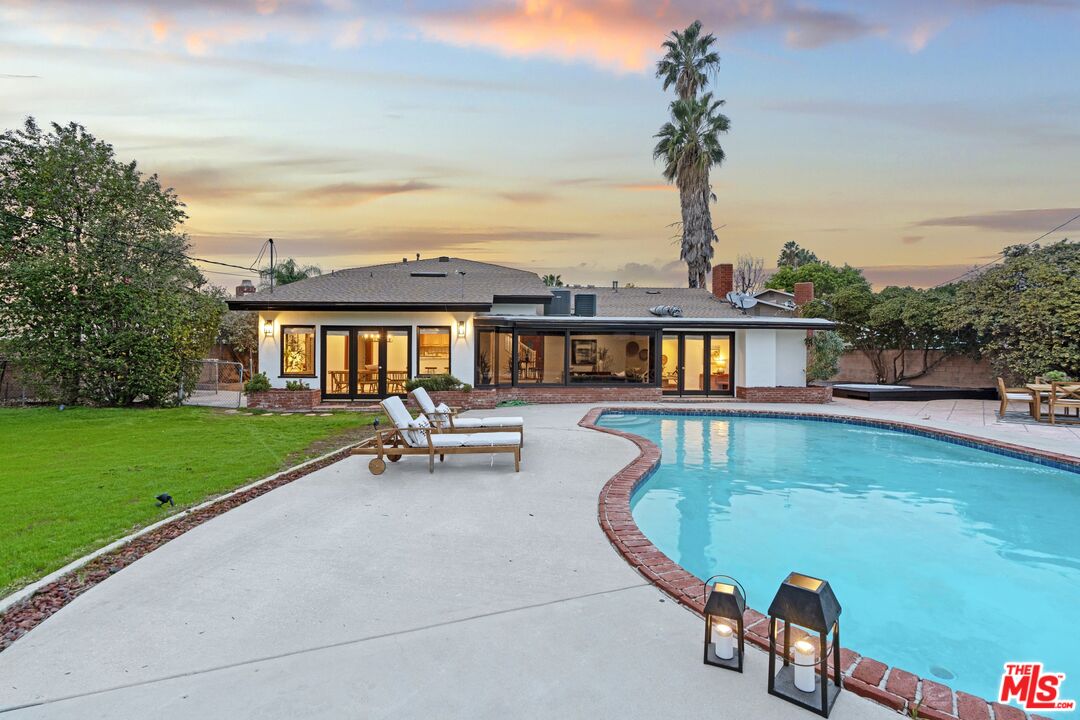 20650 Stagg Street Winnetka, CA 91306 - Photo 37 of 42 a view of a swimming pool and lounge chair