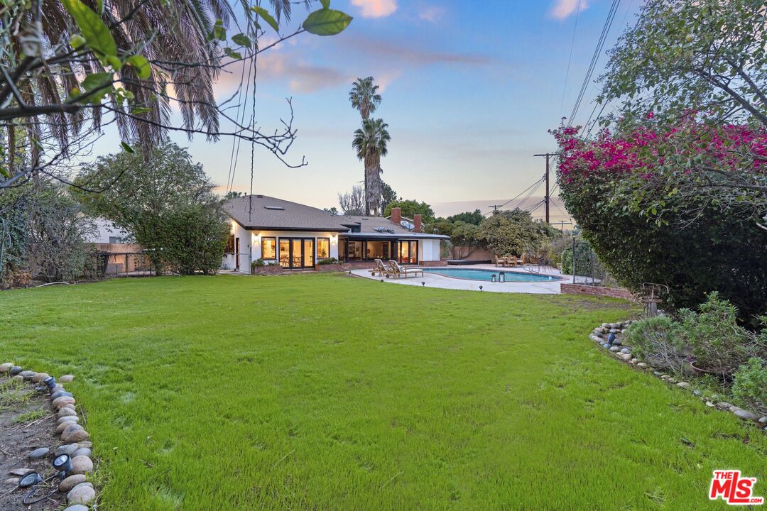 20650 Stagg Street Winnetka, CA 91306 - Photo 38 of 42 a front view of house with yard