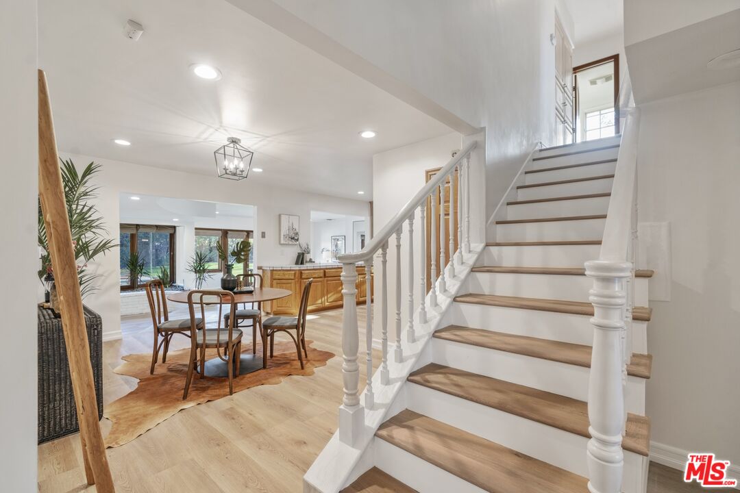 20650 Stagg Street Winnetka, CA 91306 - Photo 5 of 42 a view of a dining room with furniture entryway and wooden floor