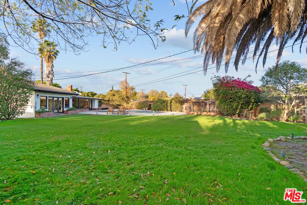 20650 Stagg Street Winnetka, CA 91306 - Photo 41 of 42 a front view of a house with garden