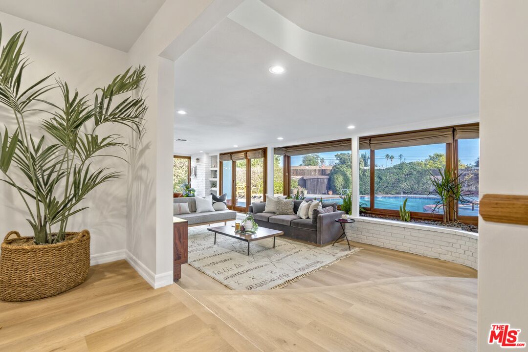 20650 Stagg Street Winnetka, CA 91306 - Photo 10 of 42 a living room with furniture large window and outer view