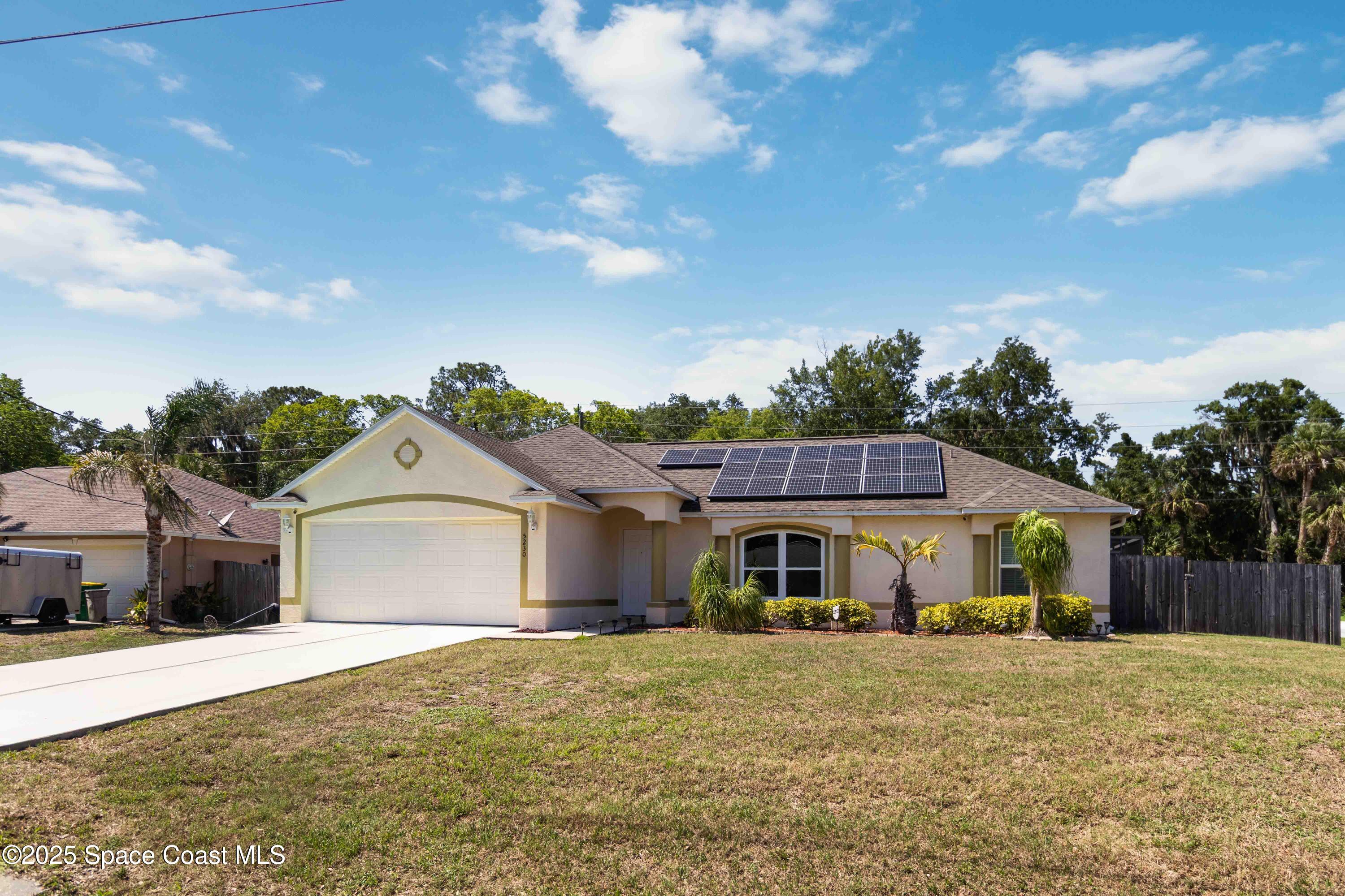 5230 Everett Street Cocoa, FL 32927 - Photo 29 of 29 a front view of a house with a garden