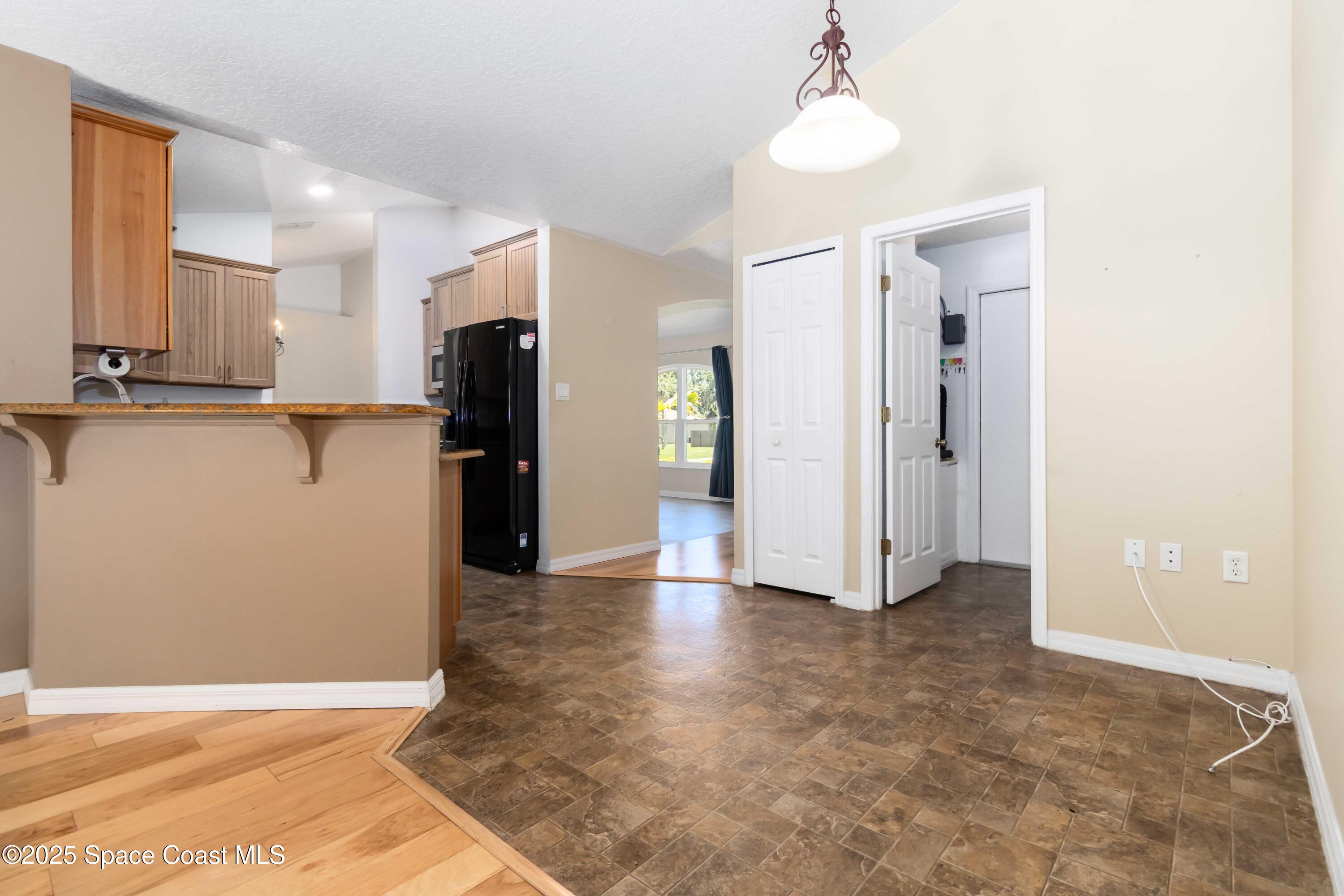 5230 Everett Street Cocoa, FL 32927 - Photo 10 of 29 a view of a kitchen with refrigerator and a sink