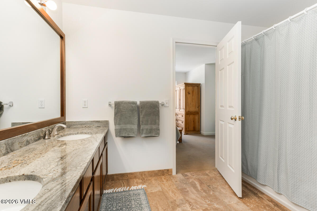 39 Red Tail Drive Edwards, CO 81632 - Photo 17 of 24 a bathroom with a granite countertop sink and a mirror