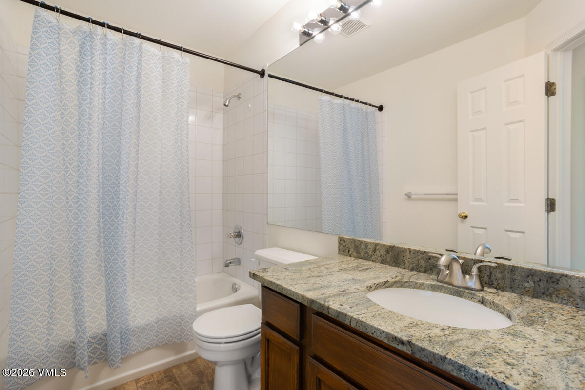 39 Red Tail Drive Edwards, CO 81632 - Photo 19 of 24 a bathroom with a granite countertop sink and a mirror