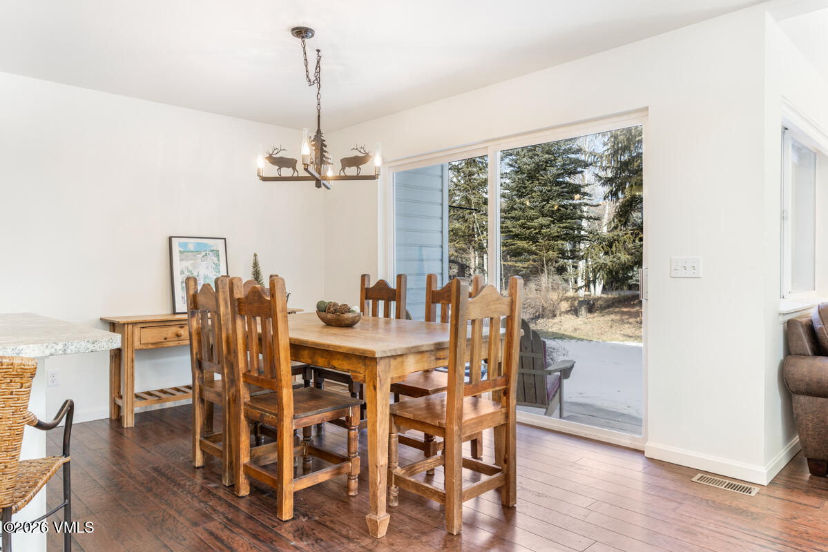 39 Red Tail Drive Edwards, CO 81632 - Photo 8 of 24 a view of a dining room with furniture window and wooden floor