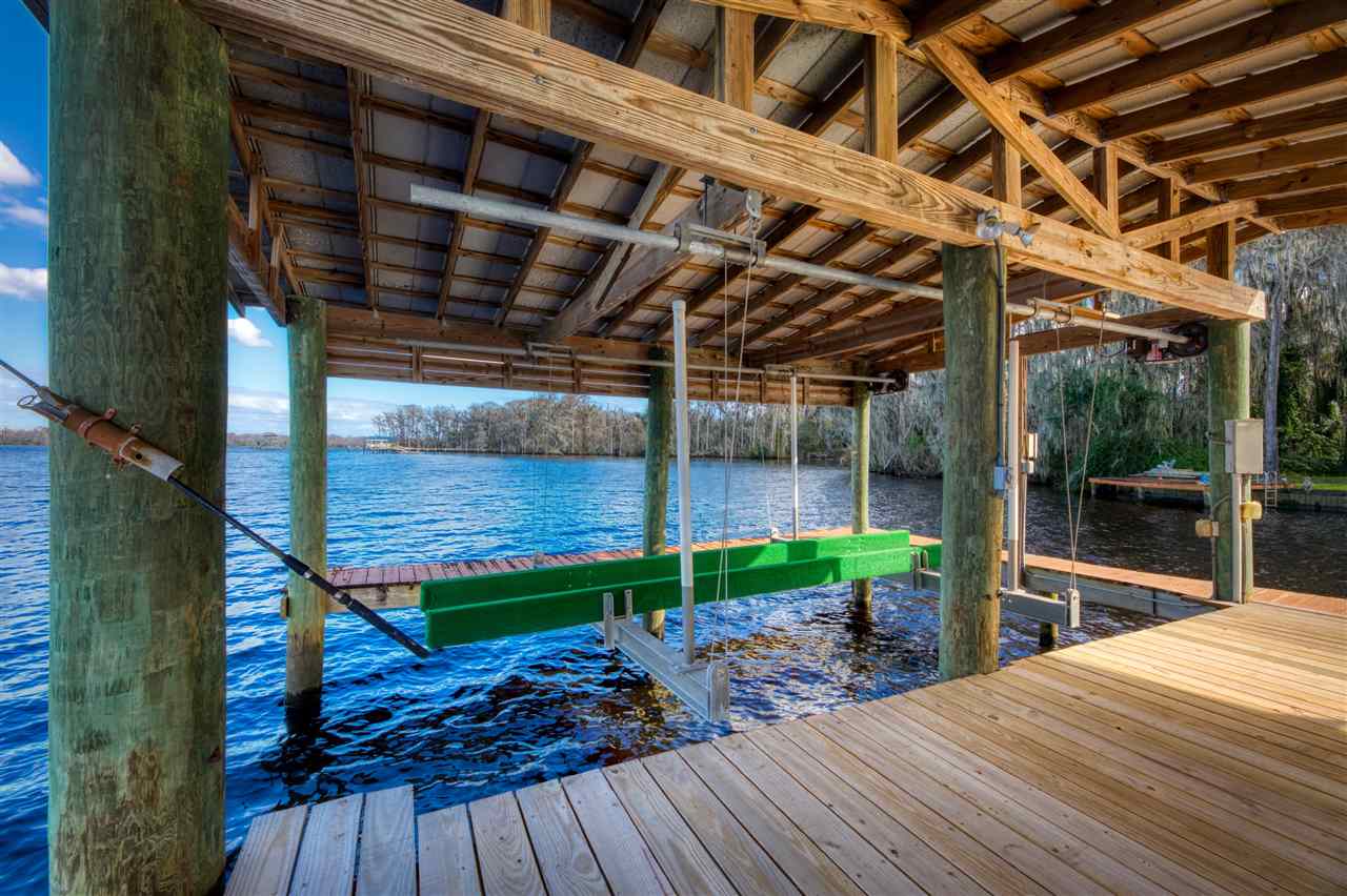 8580 G Palmo Fish Camp Road St. Augustine, FL 32092 - Photo 12 of 48 a view of porch with wooden floor and outdoor space