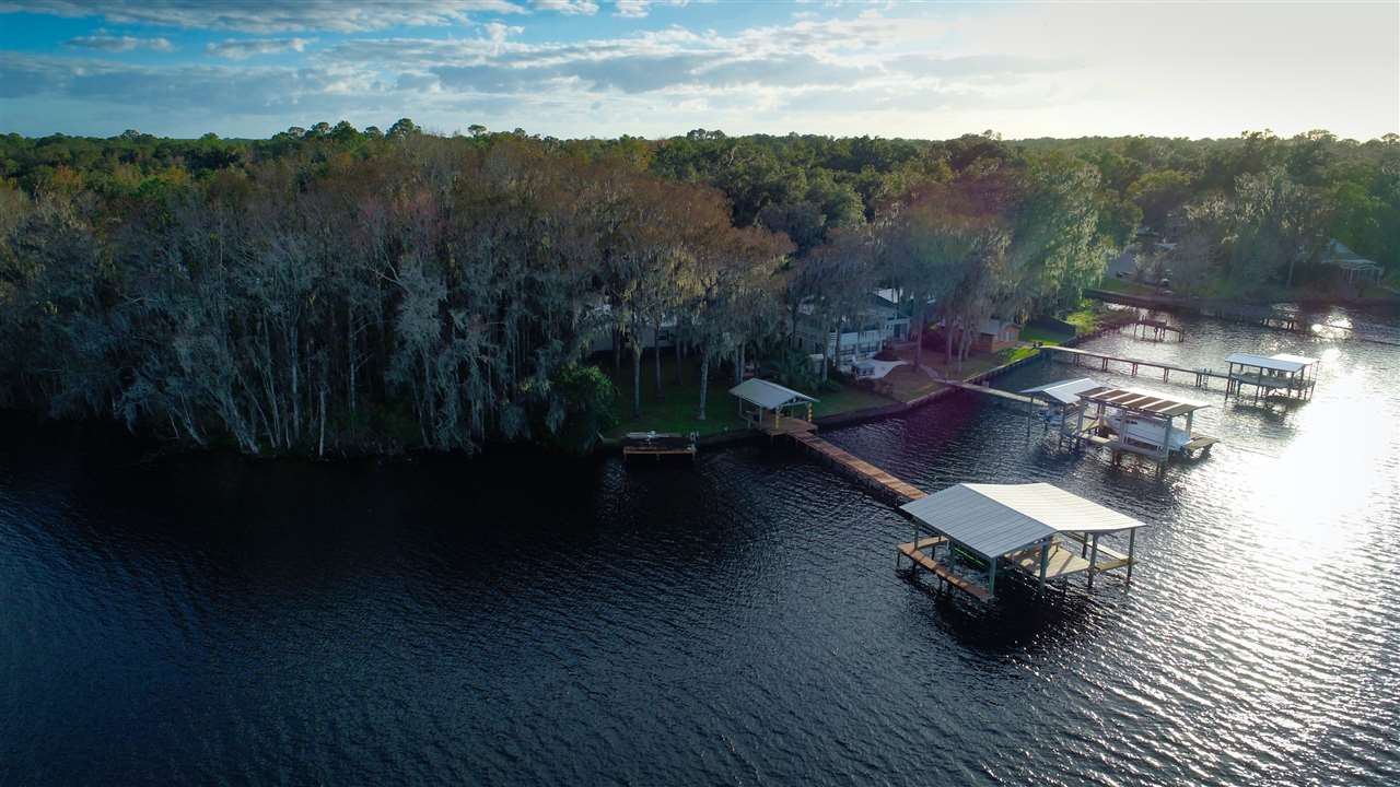 8580 G Palmo Fish Camp Road St. Augustine, FL 32092 - Photo 20 of 48 a view of a terrace with wooden floor and lake view
