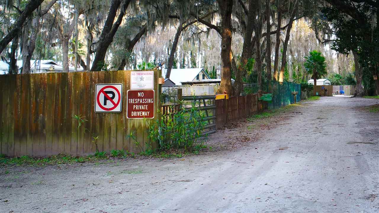 8580 G Palmo Fish Camp Road St. Augustine, FL 32092 - Photo 24 of 48 a sign that is on a brick wall