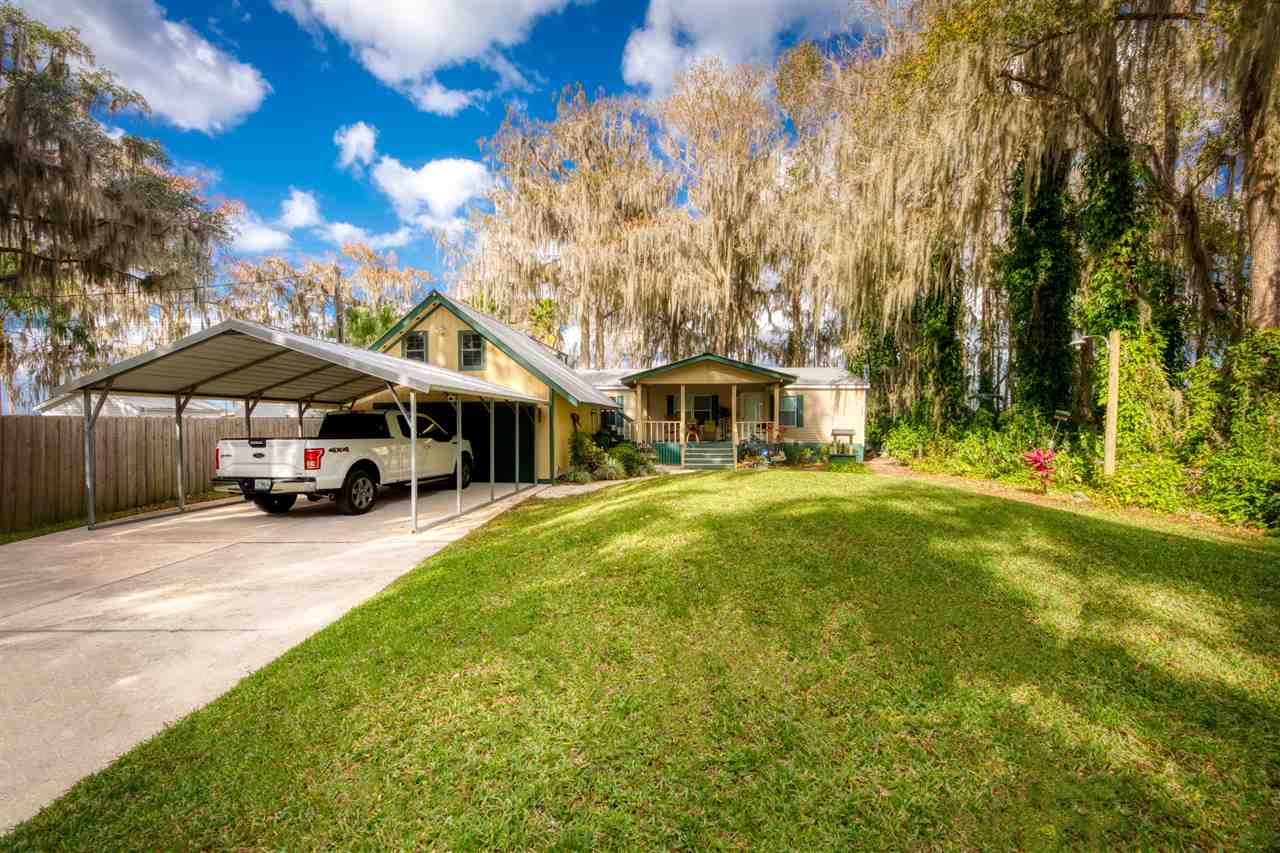 8580 G Palmo Fish Camp Road St. Augustine, FL 32092 - Photo 25 of 48 a view of a house with pool and sitting area