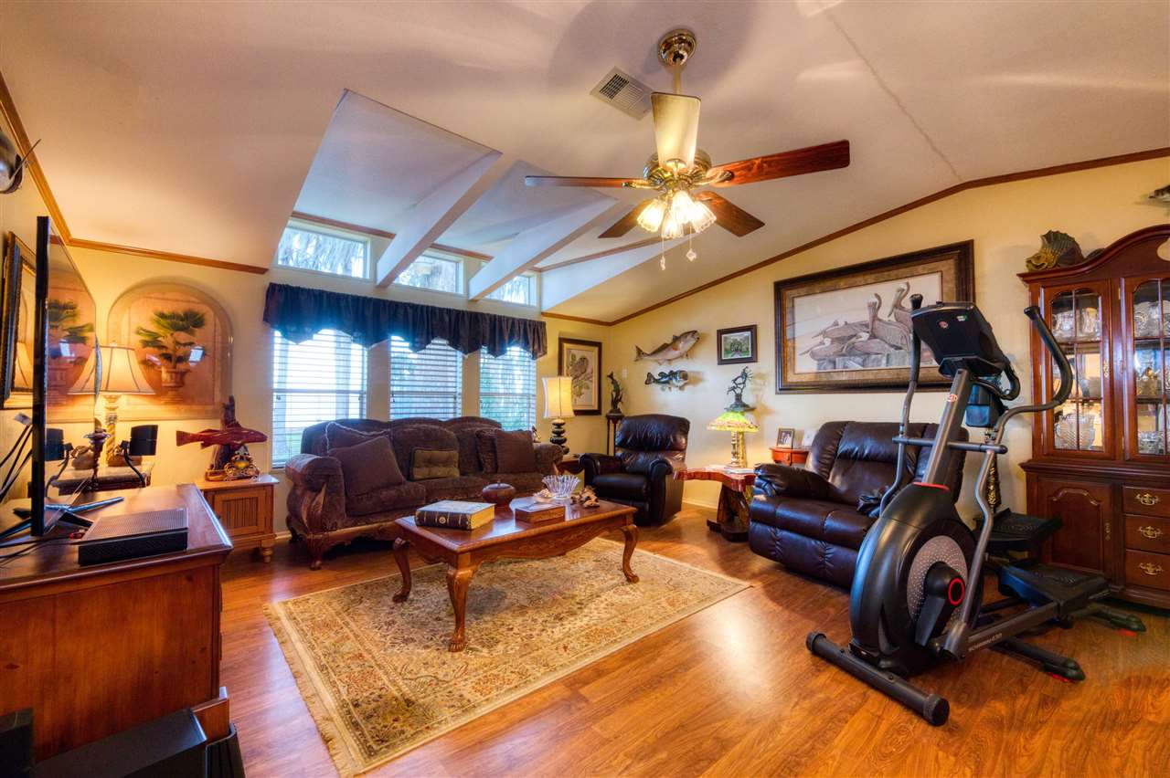 8580 G Palmo Fish Camp Road St. Augustine, FL 32092 - Photo 33 of 48 a living room with furniture