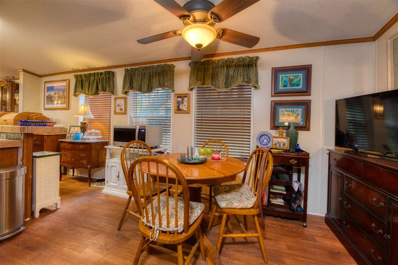 8580 G Palmo Fish Camp Road St. Augustine, FL 32092 - Photo 39 of 48 a dining room with furniture and window