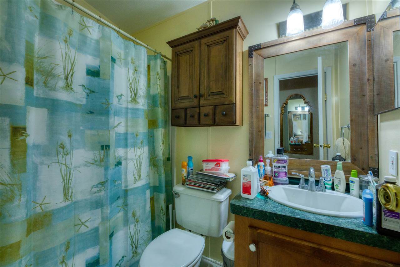 8580 G Palmo Fish Camp Road St. Augustine, FL 32092 - Photo 46 of 48 a bathroom with a sink a toilet and shower