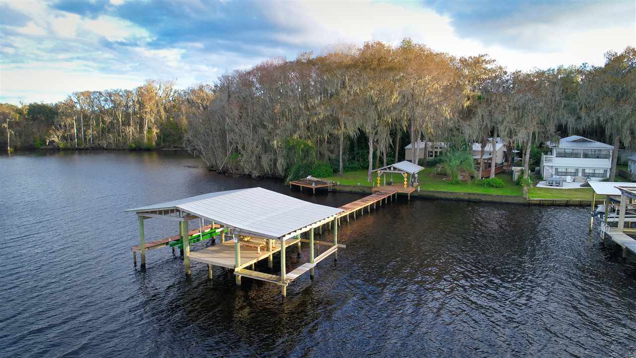 8580 G Palmo Fish Camp Road St. Augustine, FL 32092 - Photo 48 of 48 an aerial view of a house with a yard basket ball court and outdoor seating