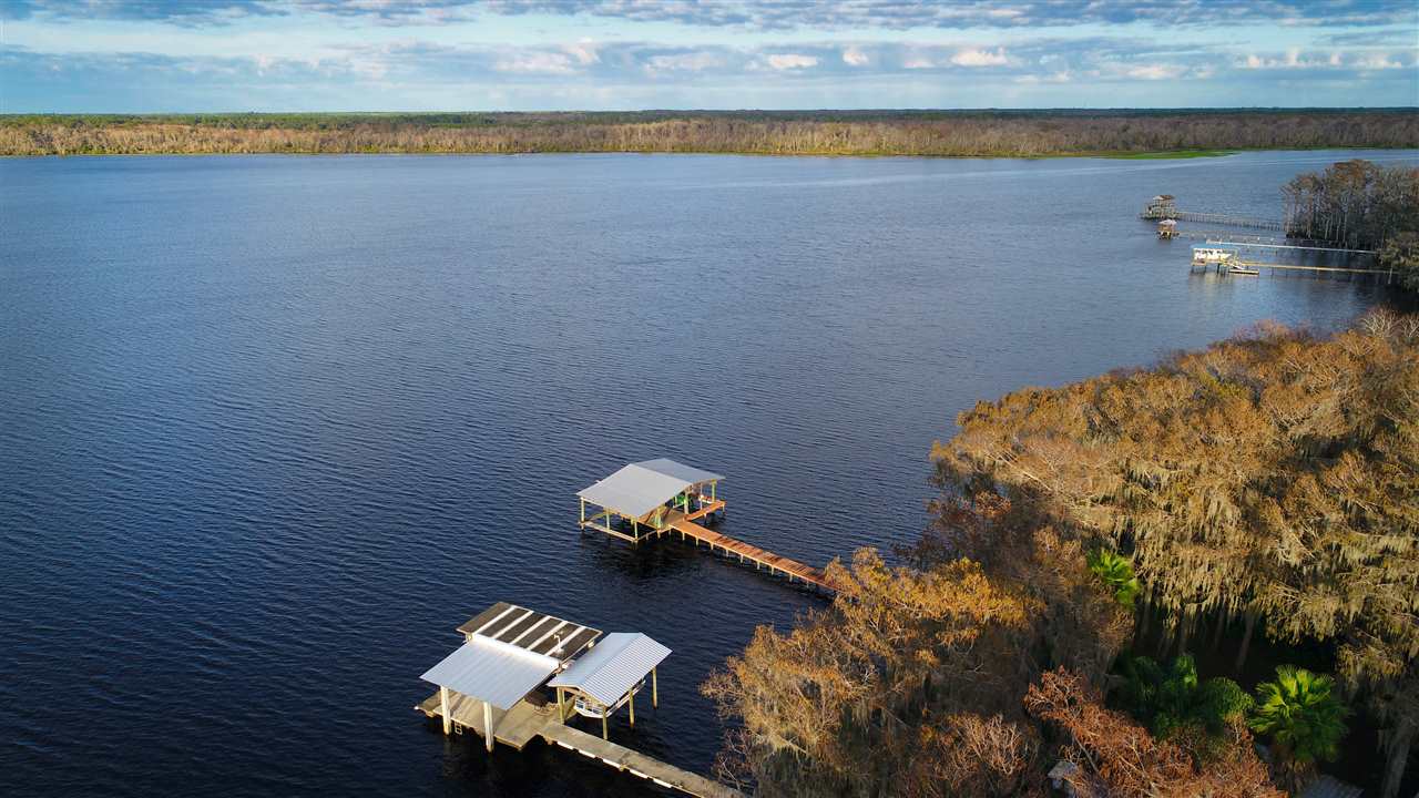 8580 G Palmo Fish Camp Road St. Augustine, FL 32092 - Photo 8 of 48 a view of water heater room with water view and living room in back