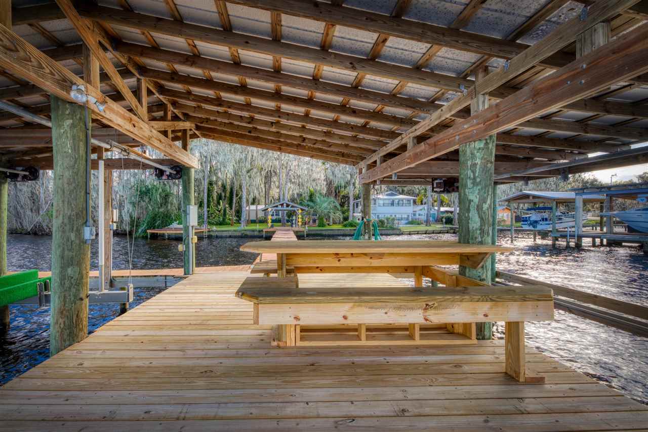 8580 G Palmo Fish Camp Road St. Augustine, FL 32092 - Photo 10 of 48 a view of a swimming pool with a patio