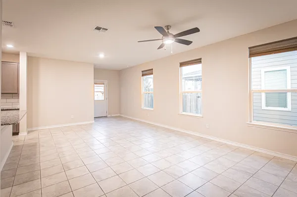a view of an empty room with a window