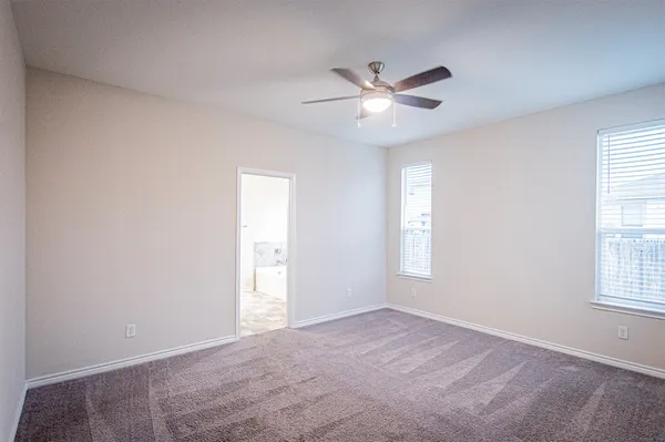 a kitchen with stainless steel appliances granite countertop a refrigerator and a stove