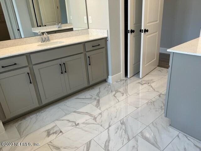 60 Pine Forest Court St. Augustine, FL 32092 - Photo 13 of 26 a bathroom with a sink and mirror