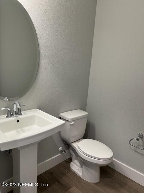 60 Pine Forest Court St. Augustine, FL 32092 - Photo 15 of 26 a white toilet sitting next to a bathroom sink
