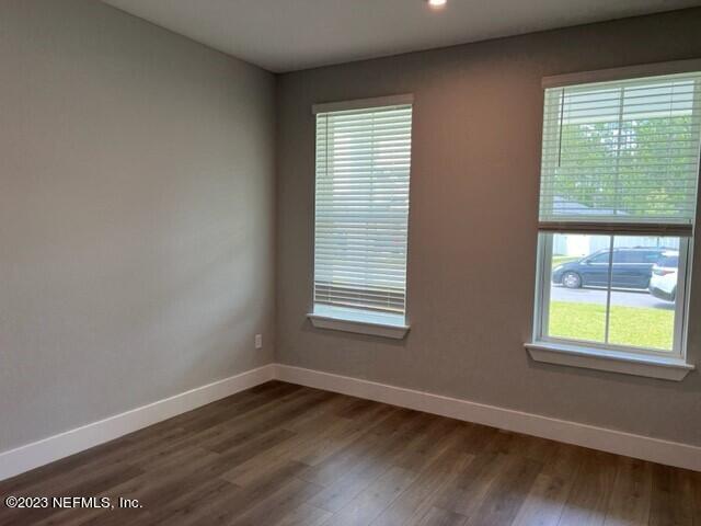 60 Pine Forest Court St. Augustine, FL 32092 - Photo 16 of 26 a view of an empty room with wooden floor and a window