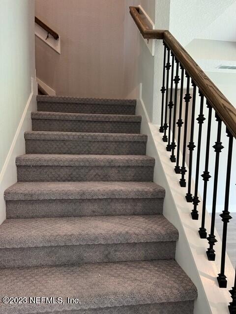 60 Pine Forest Court St. Augustine, FL 32092 - Photo 17 of 26 a view of staircase with white walls