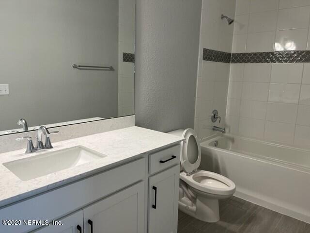60 Pine Forest Court St. Augustine, FL 32092 - Photo 22 of 26 a bathroom with a sink a toilet and shower