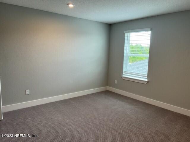 60 Pine Forest Court St. Augustine, FL 32092 - Photo 23 of 26 an empty room with a window