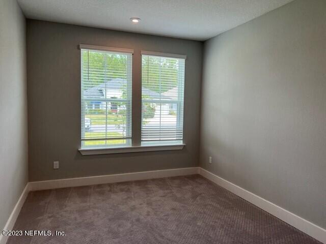 60 Pine Forest Court St. Augustine, FL 32092 - Photo 25 of 26 an empty room with a window