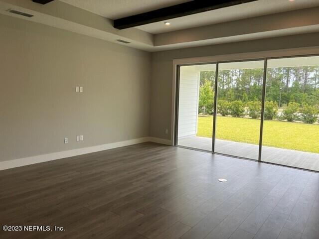 60 Pine Forest Court St. Augustine, FL 32092 - Photo 5 of 26 a view of an empty room with wooden floor and a window