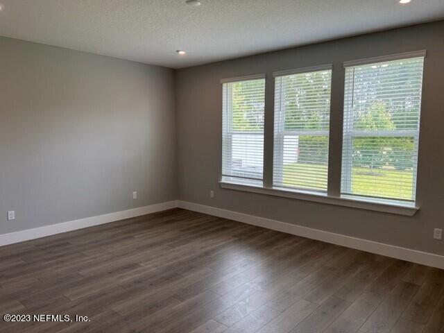 60 Pine Forest Court St. Augustine, FL 32092 - Photo 8 of 26 a view of an empty room with wooden floor and a window