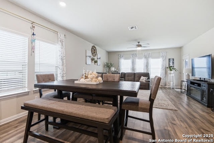 232 Colebrook Way Cibolo, TX 78108 - Photo 11 of 36 a view of a dining room with furniture and wooden floor