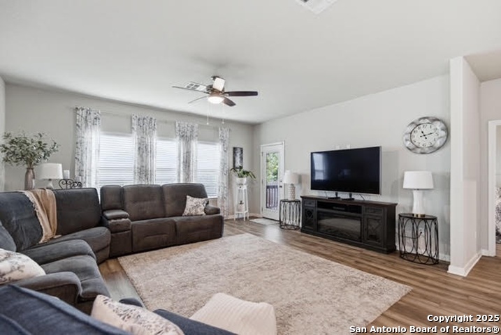 232 Colebrook Way Cibolo, TX 78108 - Photo 14 of 36 a living room with furniture and a flat screen tv