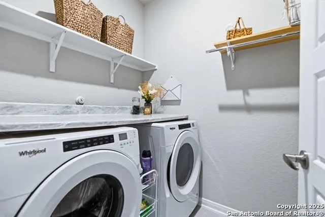 a utility room with dryer and washer