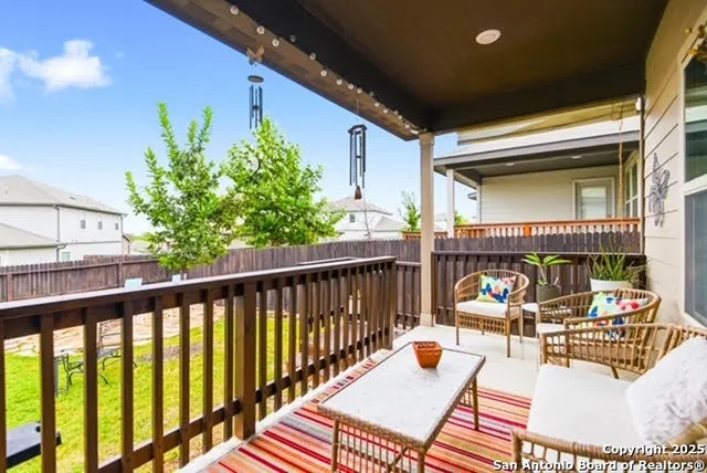 a view of balcony with furniture