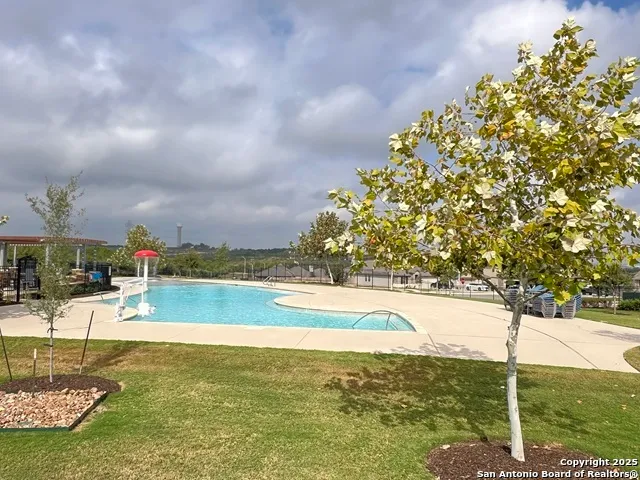 a patio with table and chairs