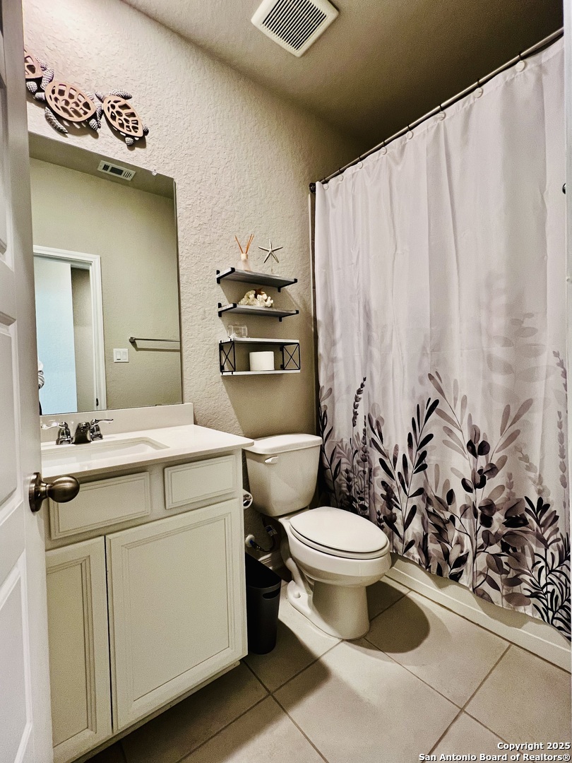 232 Colebrook Way Cibolo, TX 78108 - Photo 7 of 36 a bathroom with a sink toilet and shower