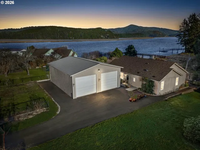 an aerial view of a house with big yard