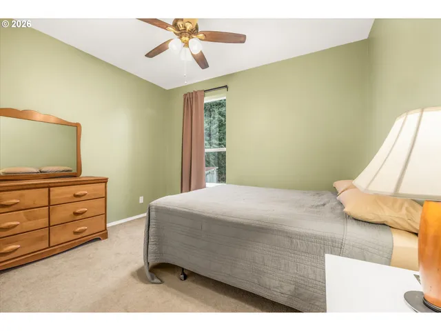 a livingroom with lounge chair and a window