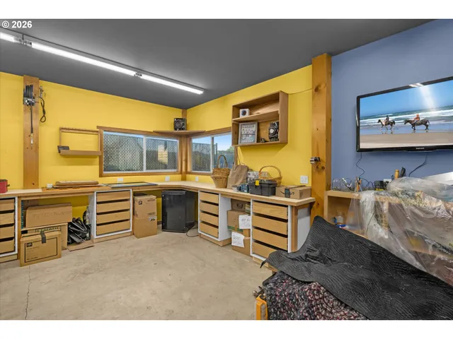 a view of an empty room with a staircase